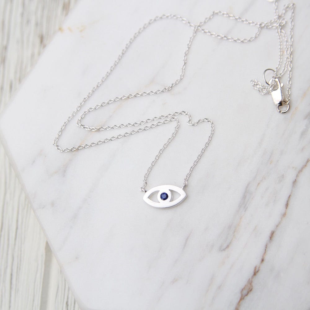 
                  
                    NKL Evil Eye Necklace with Blue Sapphire
                  
                