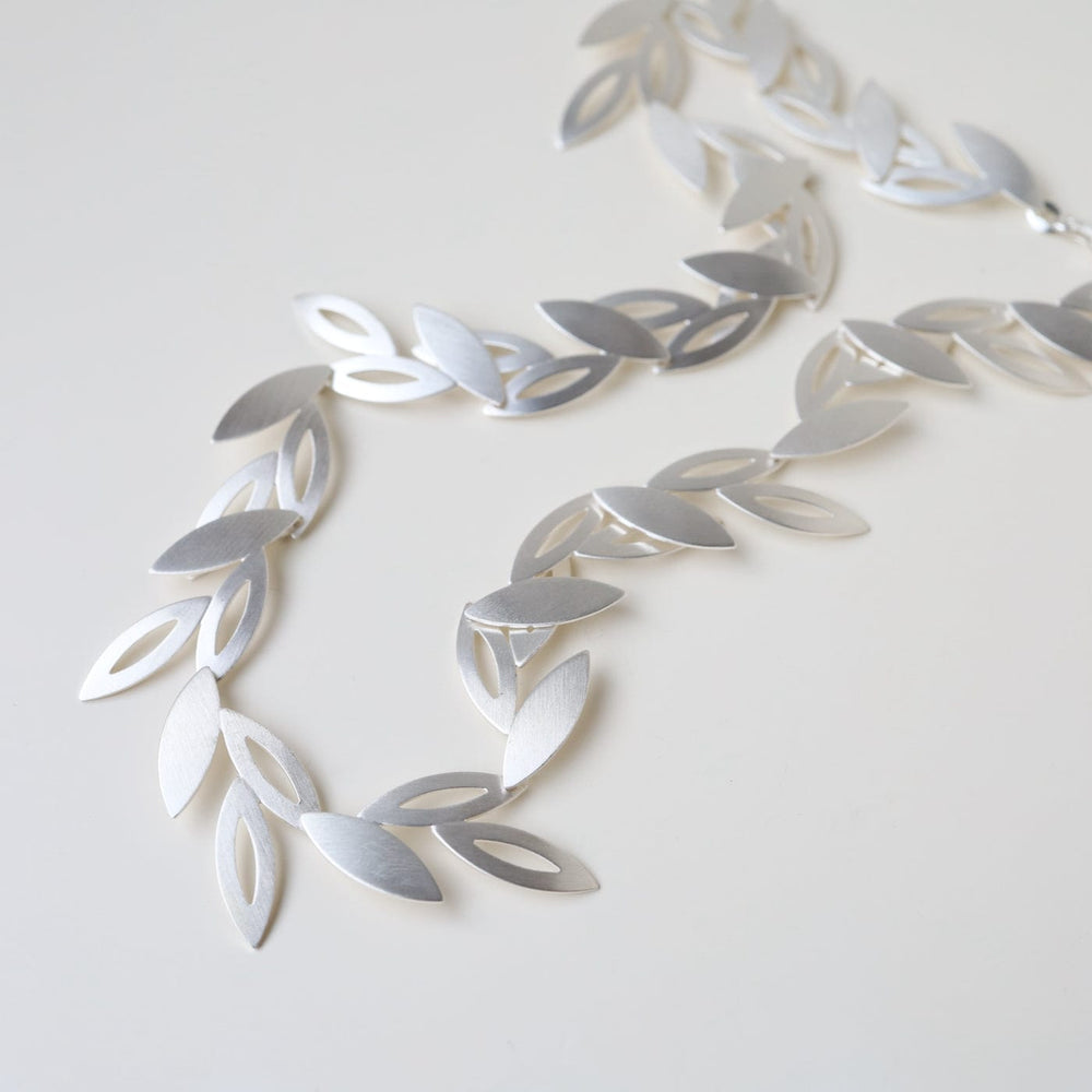 
                      
                        NKL Falling Petals Leaves Necklace
                      
                    