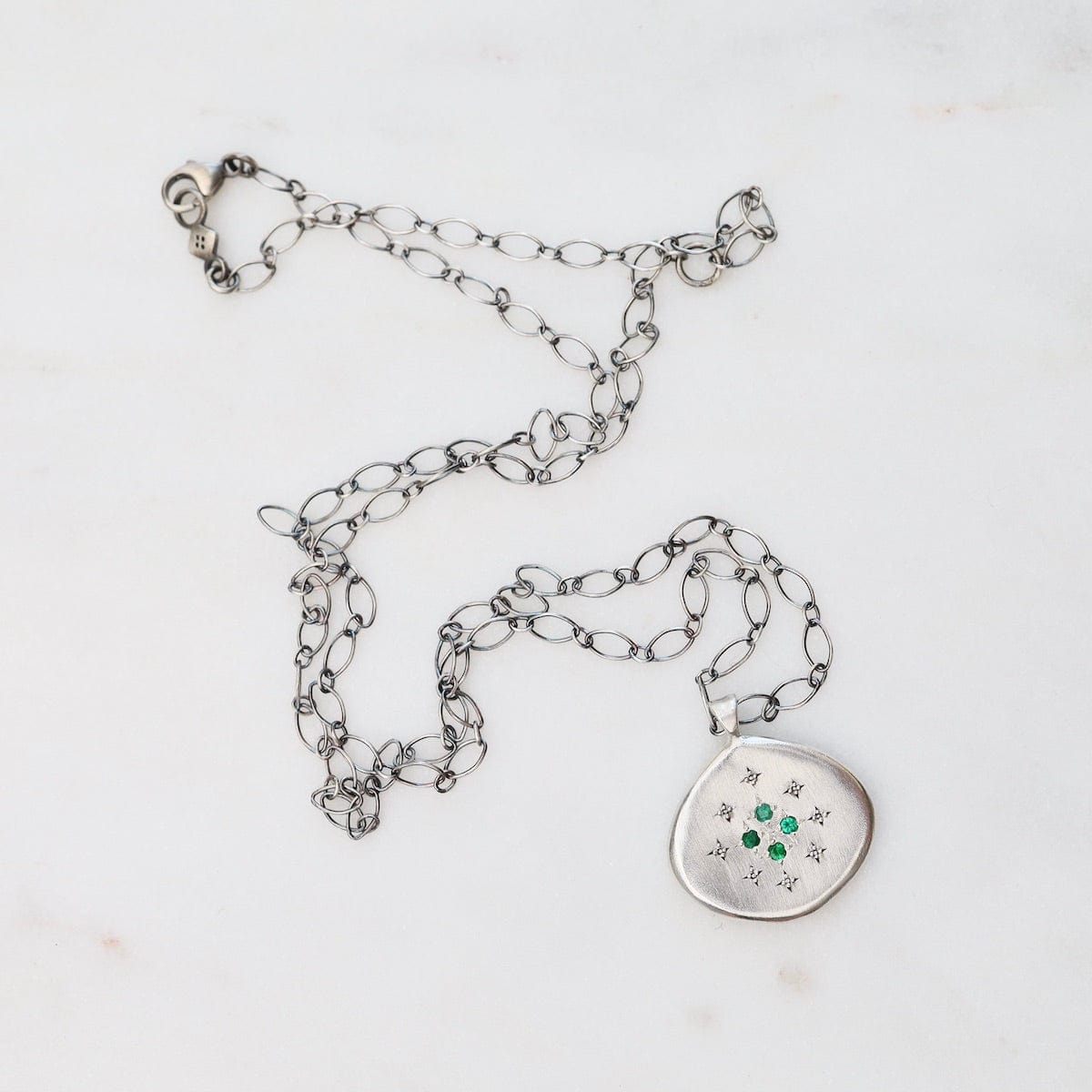 NKL Four Star Silver Lights Pendant in Emerald