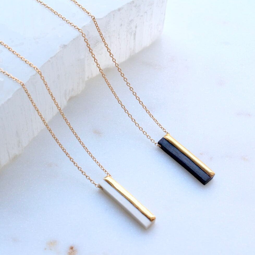 
                  
                    NKL-GF Black Bar 2 Necklace
                  
                