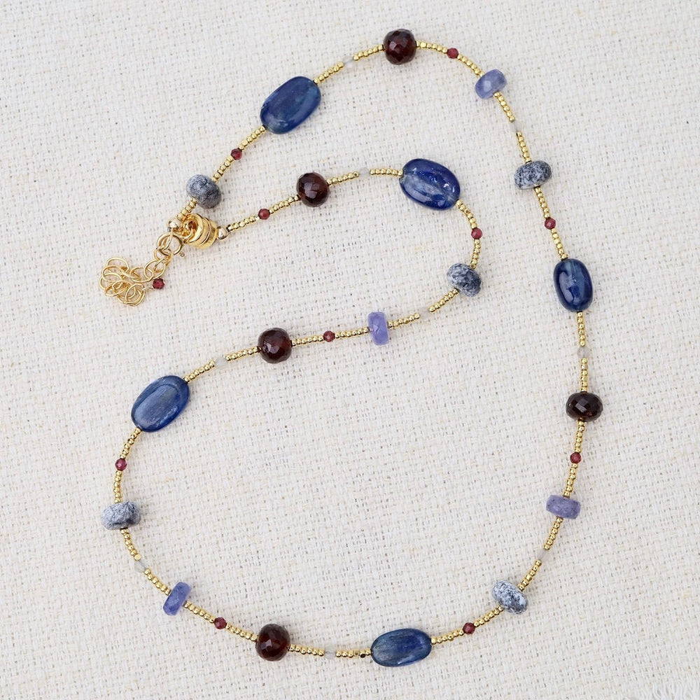 
                      
                        NKL-GF Gold glass, dendritic opal, garnet, tanzanite, kya
                      
                    