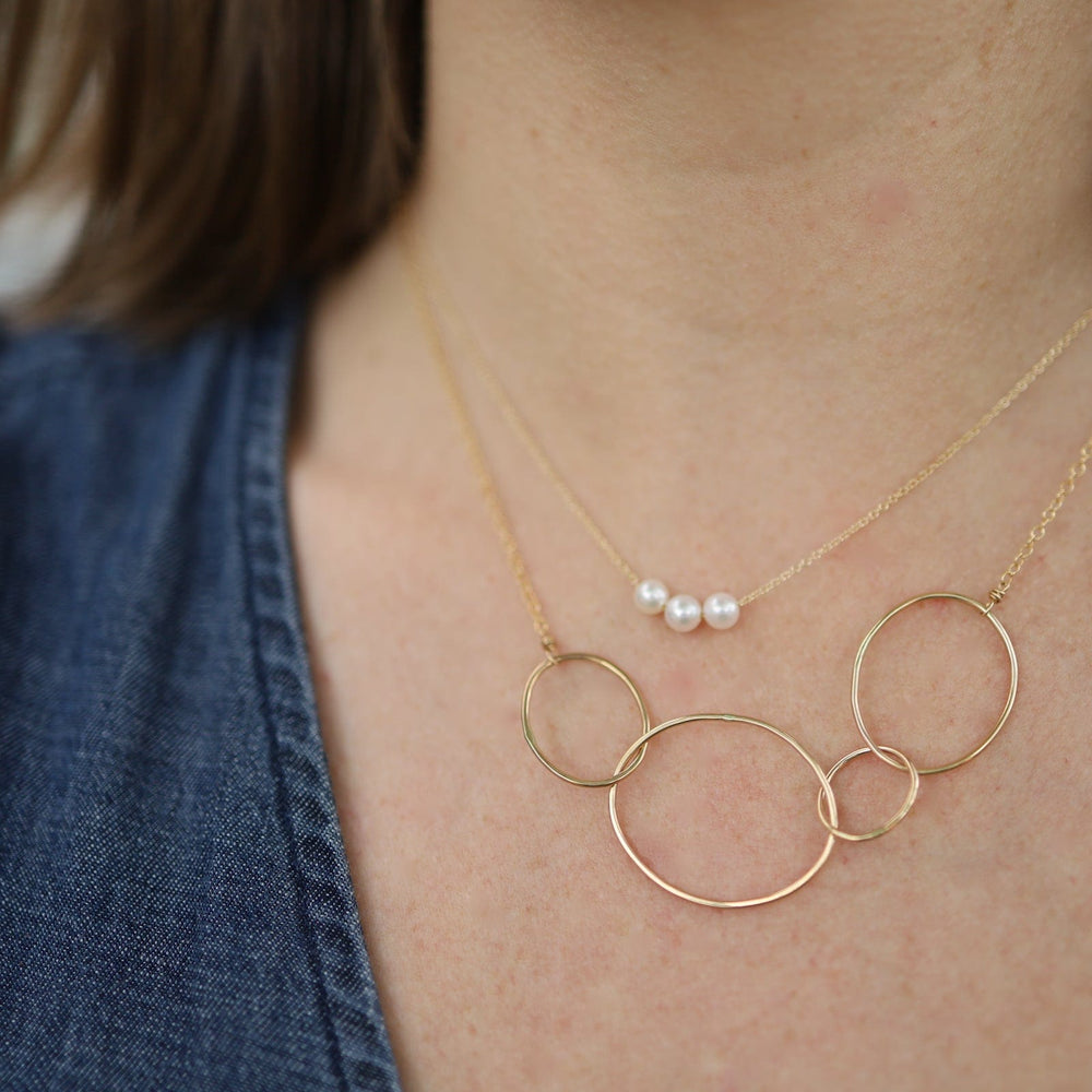 
                      
                        NKL-GF Gold Organic 4 Loop Necklace
                      
                    