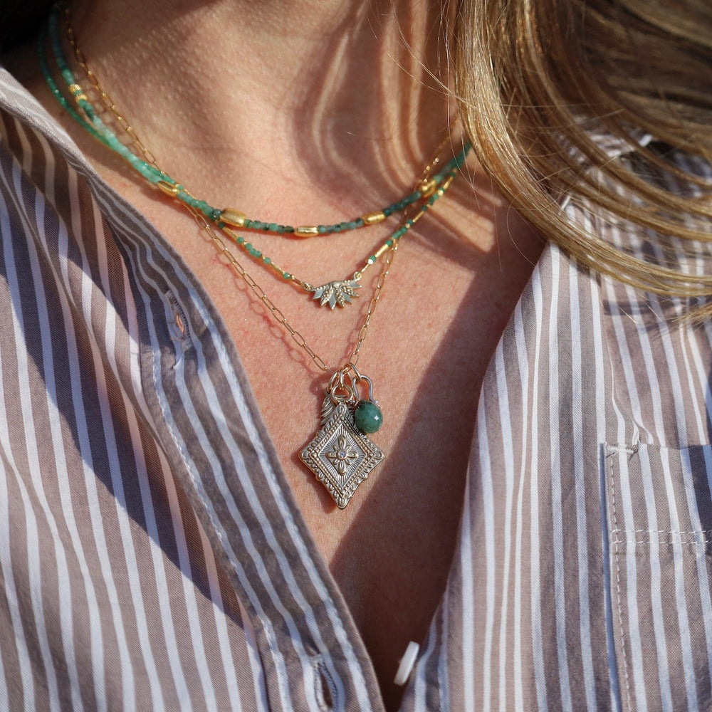 
                  
                    NKL-GF Lhasa Necklace with Emerald
                  
                