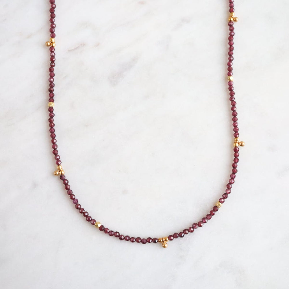 
                      
                        NKL-GF Red Garnet Tiny Gold Ball Charms Necklace
                      
                    