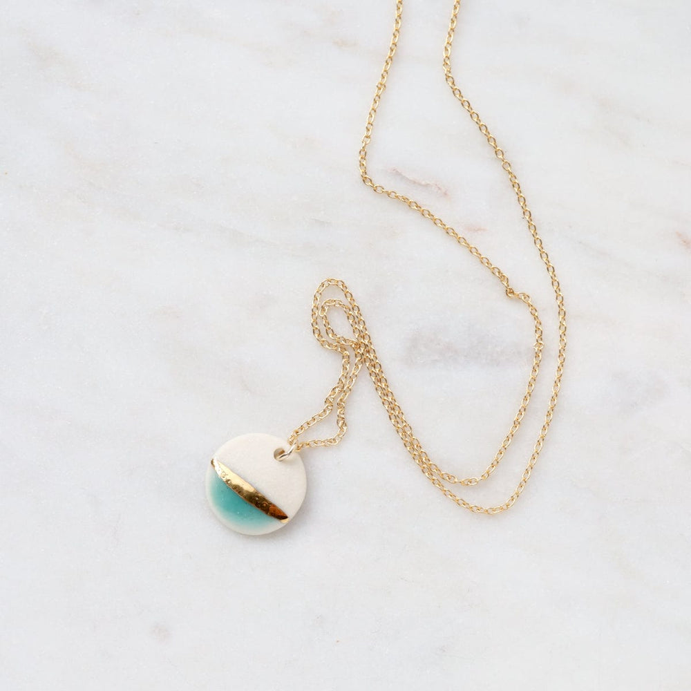 
                  
                    NKL-GF Sriped Gold Dipped Circle Necklace
                  
                