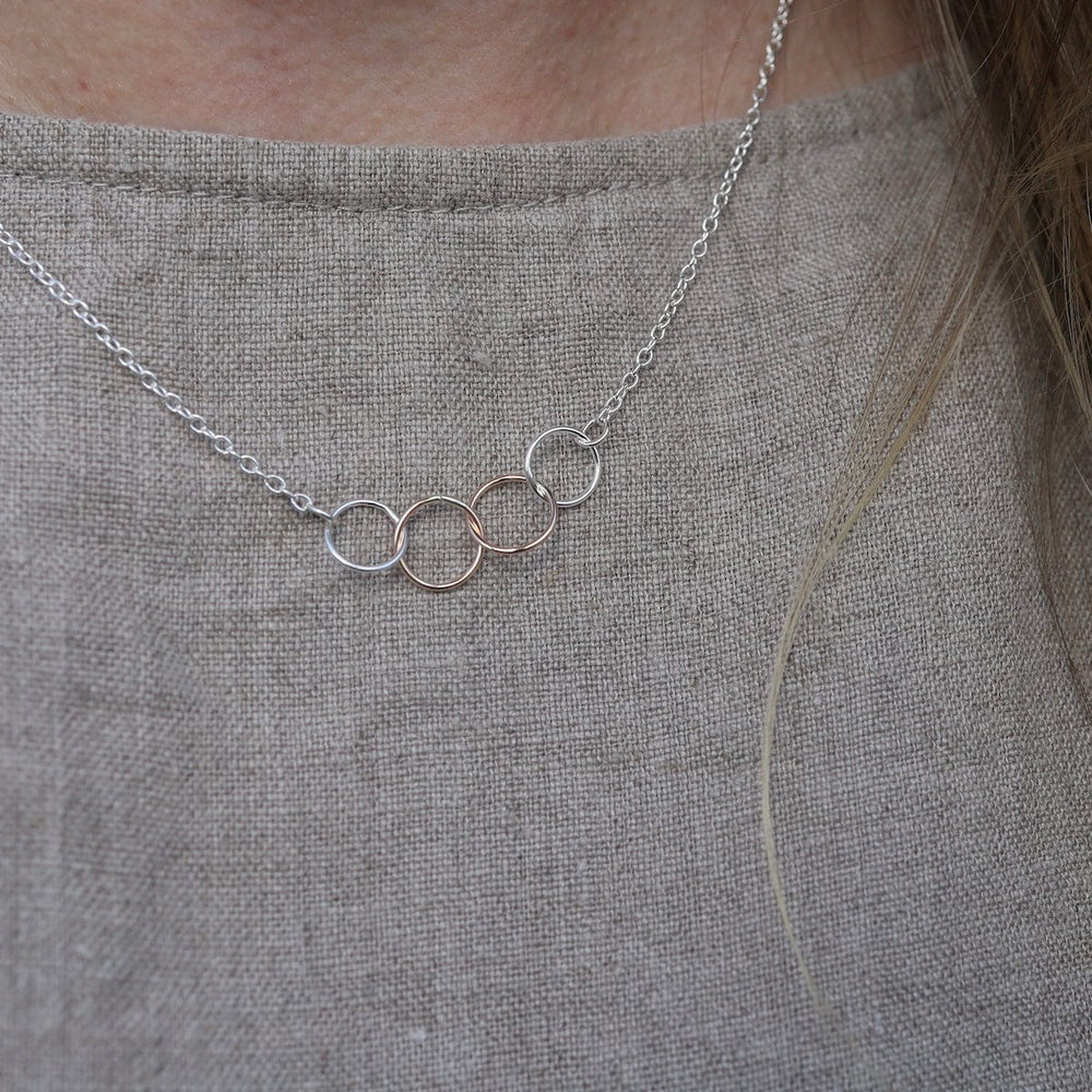 
                  
                    NKL-GF Tiny Connected Rings Necklace Two Tone
                  
                