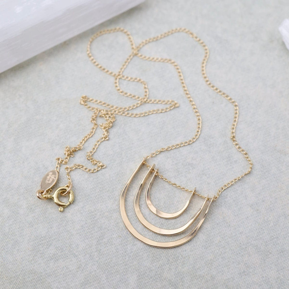 
                      
                        NKL-GF Triple Arc Necklace Gold
                      
                    