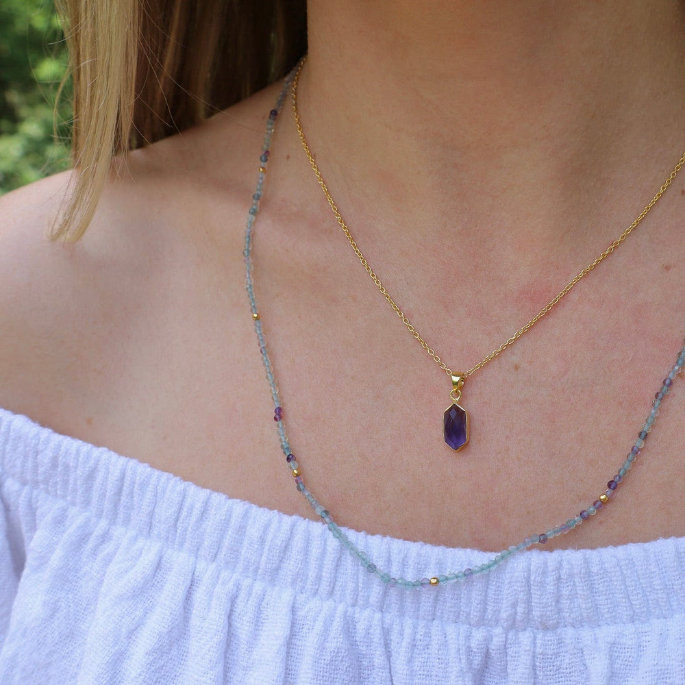 
                      
                        NKL-GPL Blue Iolite Necklace
                      
                    