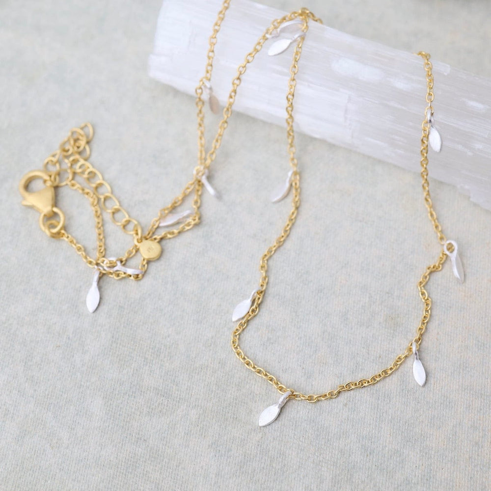 
                      
                        NKL-GPL Gold Chain with Silver Leaves Necklace
                      
                    