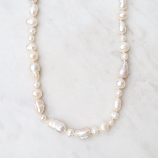 NKL-GPL Knotted Fresh Water Baroque Pearls with Beige Cord