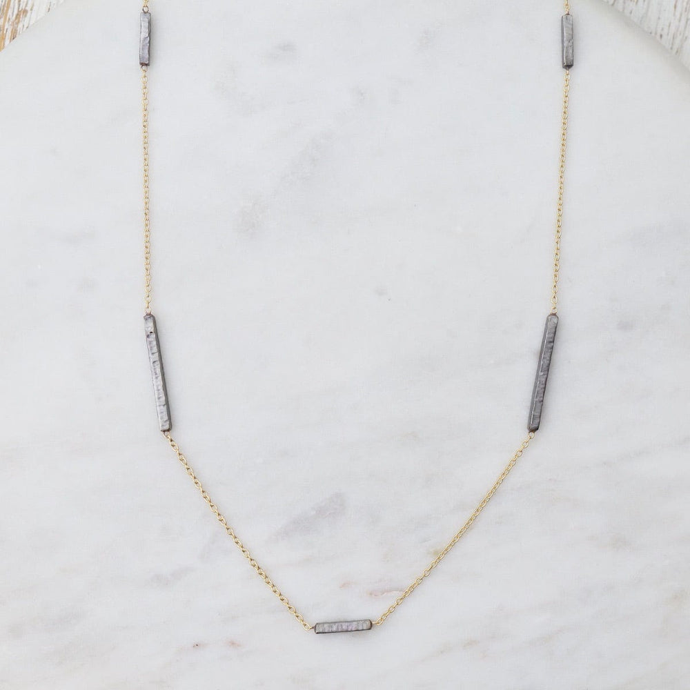 
                      
                        NKL-GPL Long Gold Necklace with Dark Rhodium Bars
                      
                    