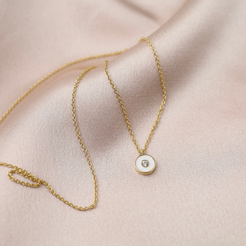 
                      
                        NKL-GPL Optic White Enamel Disc Gold Necklace
                      
                    