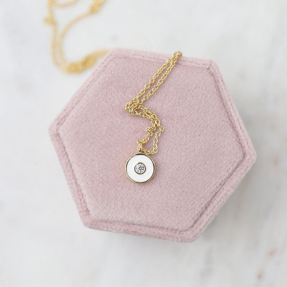 
                      
                        NKL-GPL Optic White Enamel Disc Gold Necklace
                      
                    