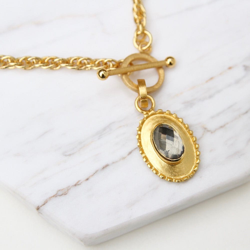 
                  
                    NKL-GPL Oval Pendant with Pyrite on Front Toggle Chain Necklace
                  
                