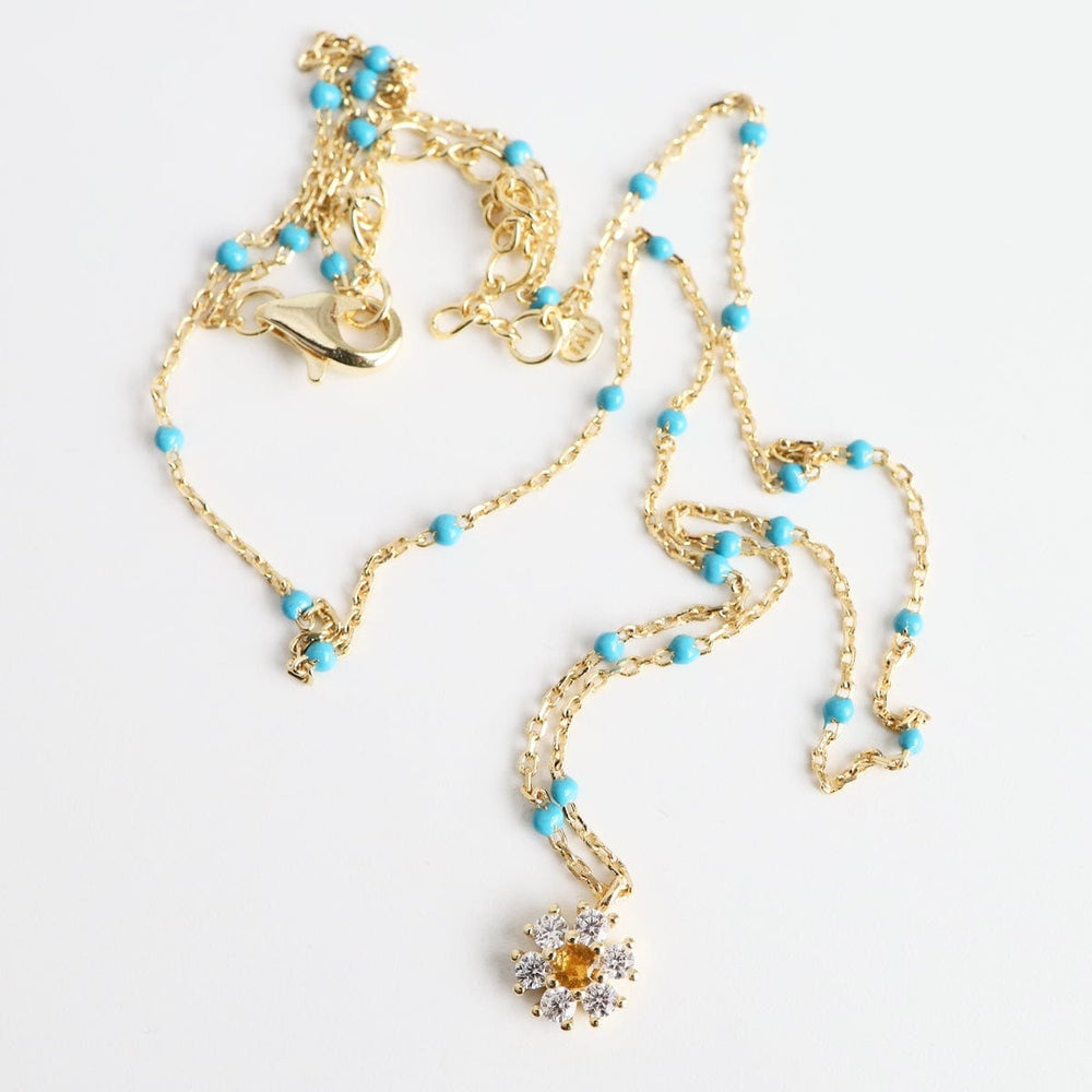 
                      
                        NKL-GPL Turquoise Epoxy Chain with CZ Flower Necklace
                      
                    