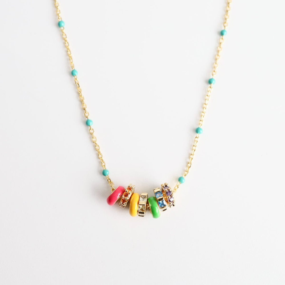 
                      
                        NKL-GPL Turquoise Epoxy Chain with Rainbow Enamel & CZ Ron
                      
                    