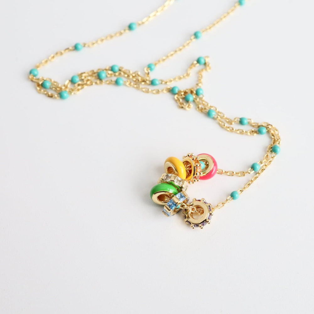 
                      
                        NKL-GPL Turquoise Epoxy Chain with Rainbow Enamel & CZ Ron
                      
                    