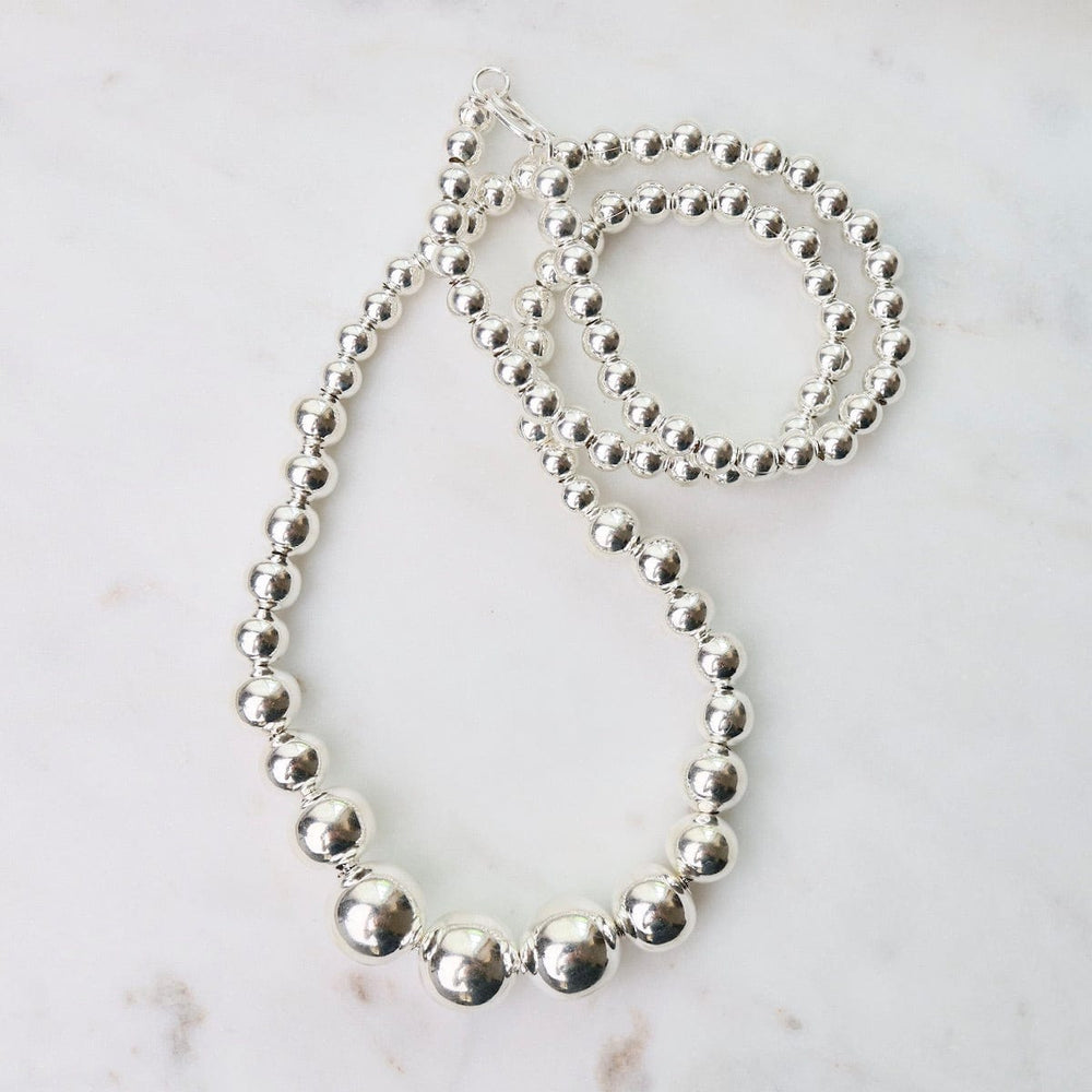 
                  
                    NKL Graduated Sterling Silver Ball Necklace
                  
                