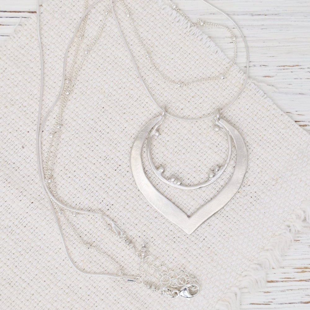 
                  
                    NKL Granulated Teardrop Pendant On Double Chain
                  
                