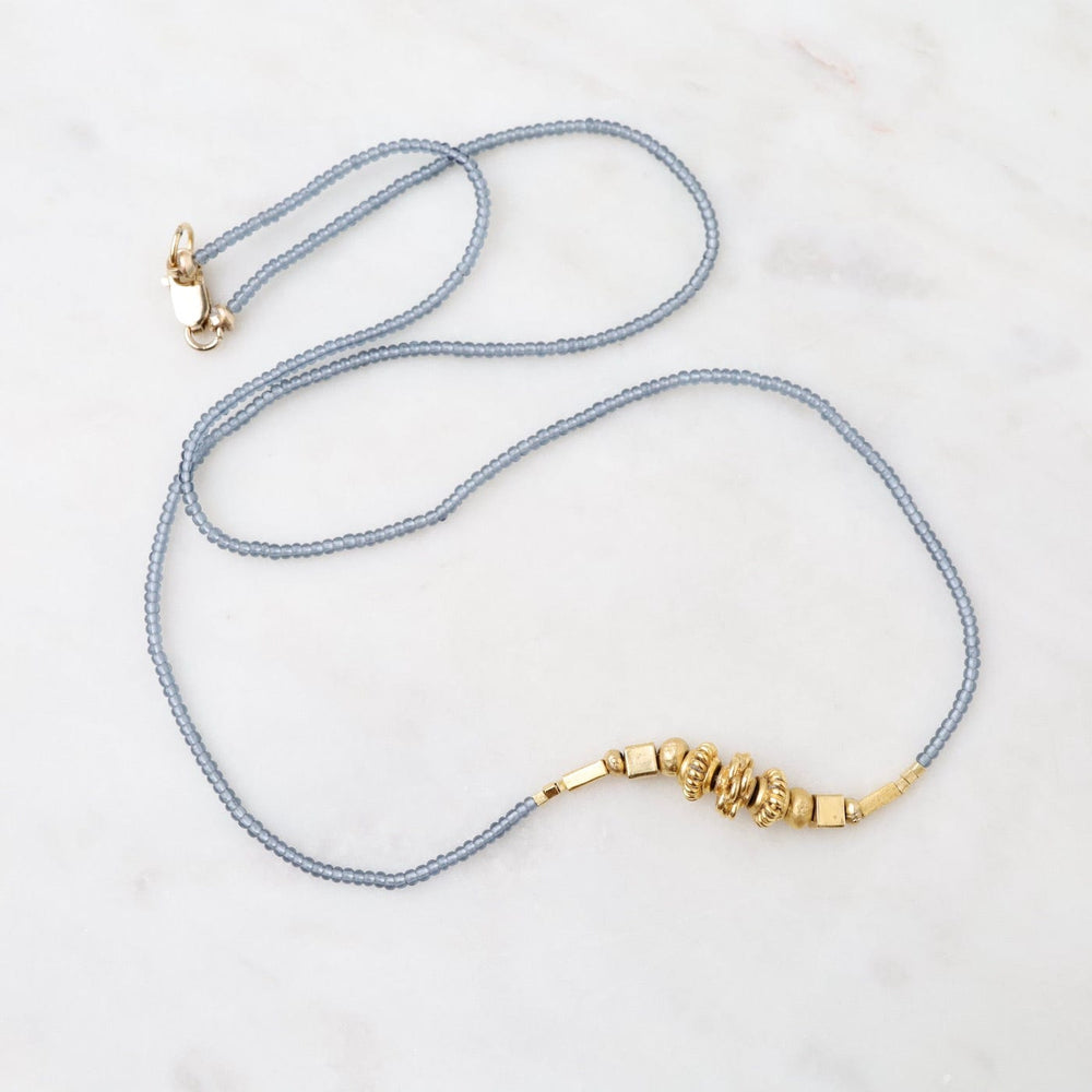 
                  
                    NKL Grey Seed and Cluster of Gold Bead Necklace
                  
                