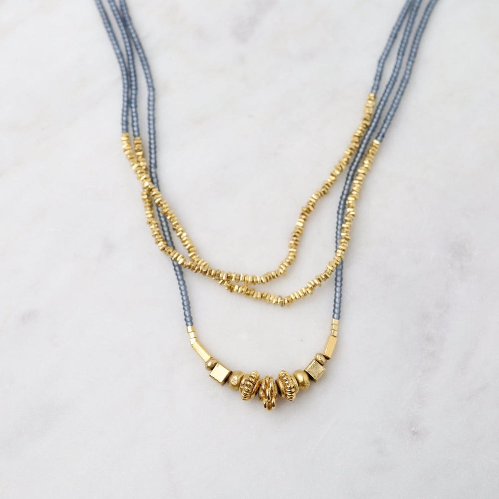 
                  
                    NKL Grey Seed and Cluster of Gold Bead Necklace
                  
                