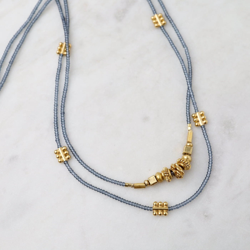 
                  
                    NKL Grey Seed and Cluster of Gold Bead Necklace
                  
                