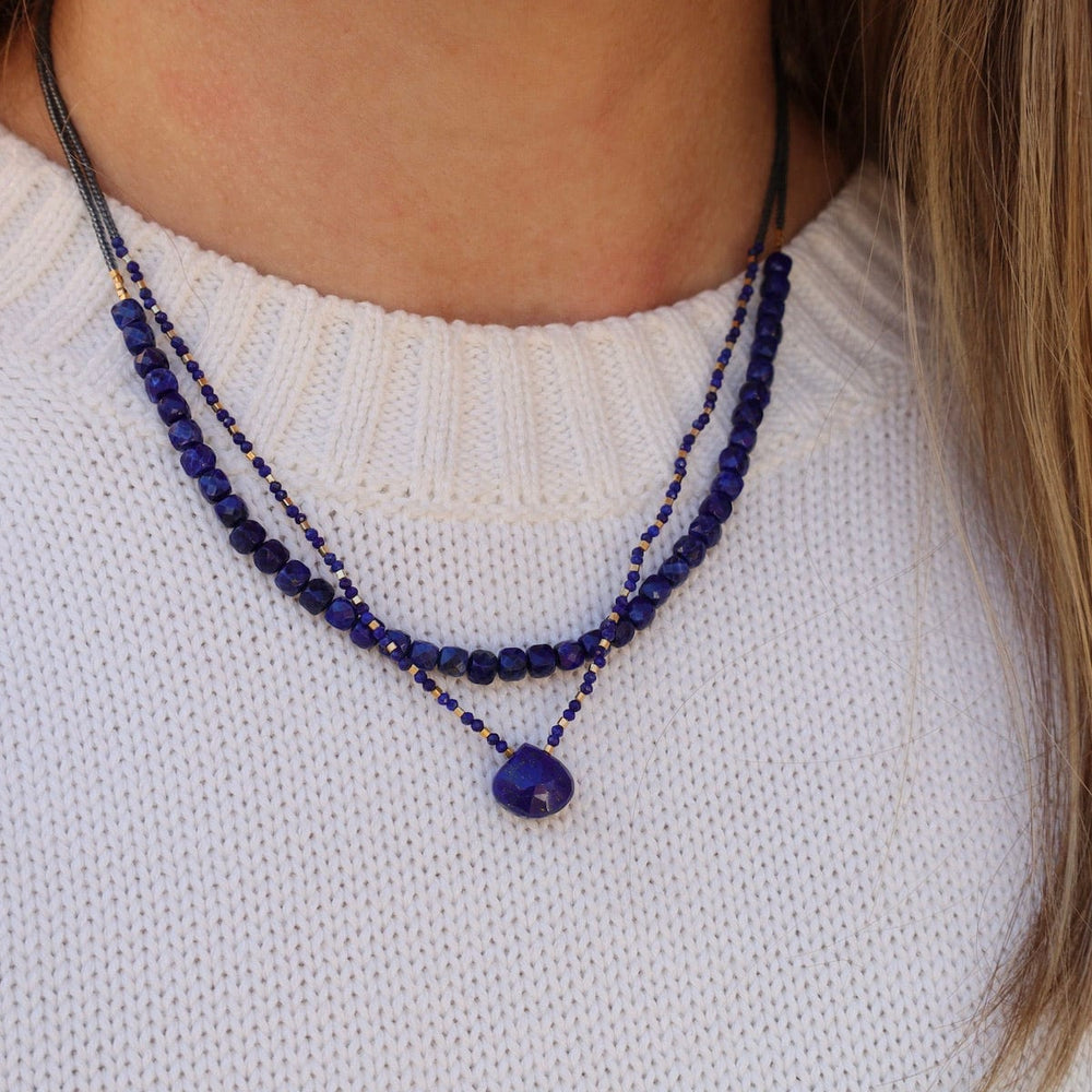 
                      
                        NKL Grey Seed Bead Necklace with Lapis Teardrop
                      
                    