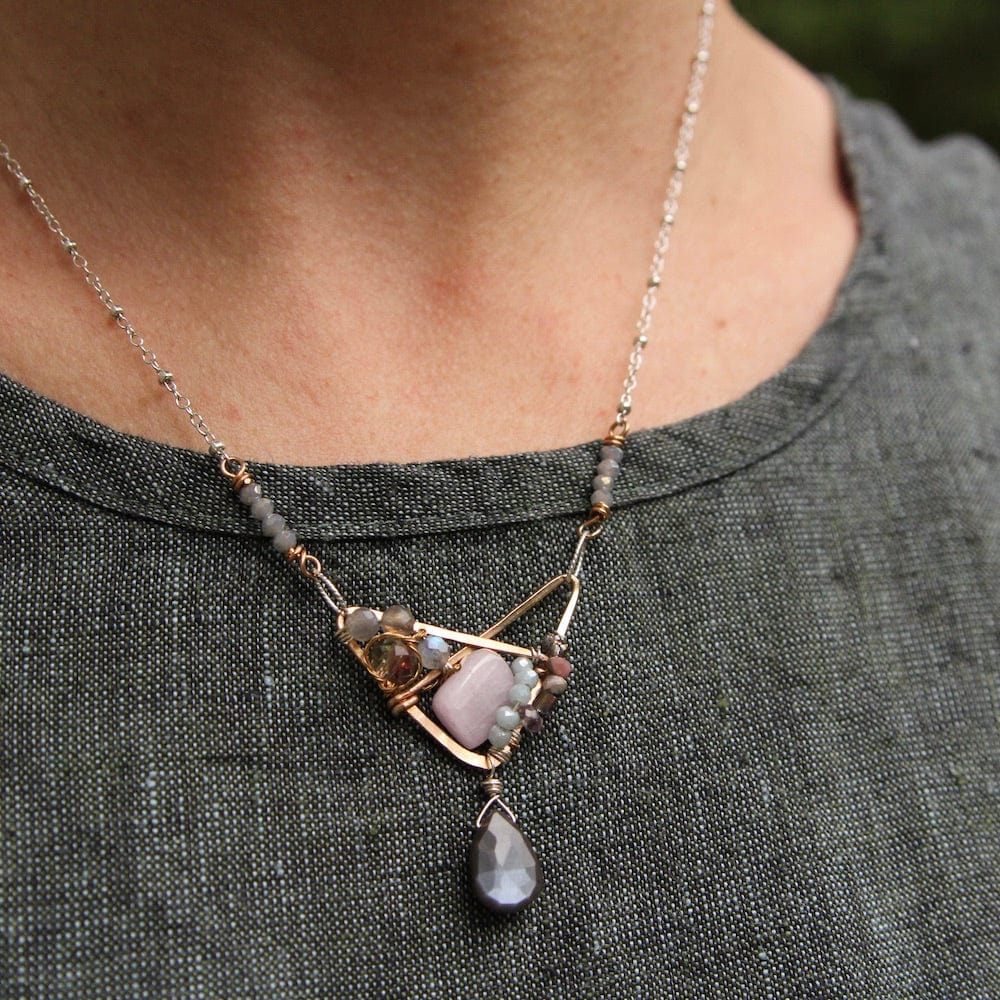 
                  
                    NKL Hand Formed Bronze Crossed Triangle Chocolate Moonstone Necklace
                  
                