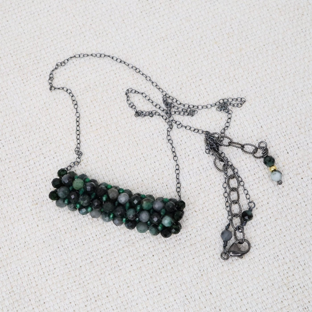 
                  
                    NKL Hand stitched Emerald with Malachite trim on 16` S
                  
                