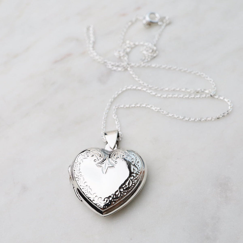 
                  
                    NKL Heart Locket Necklace with Edge Details
                  
                