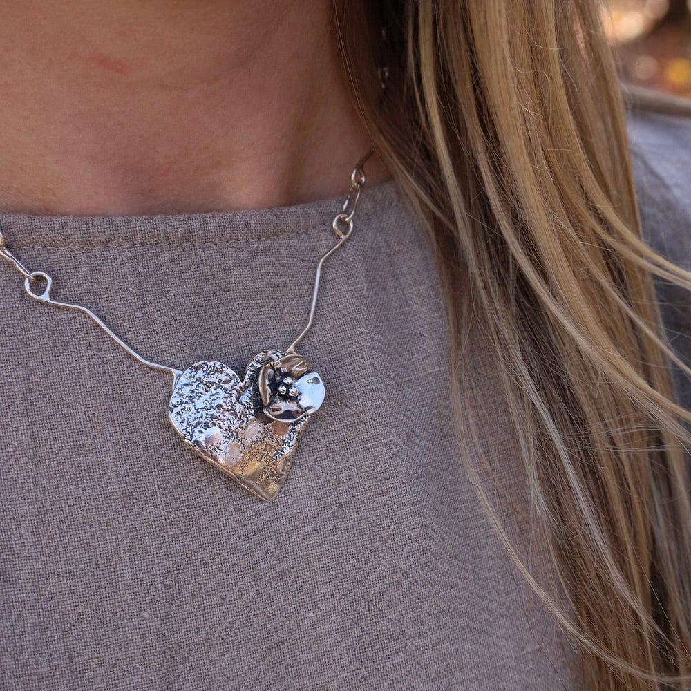 
                      
                        NKL Heart with Dogwood Flower Necklace
                      
                    