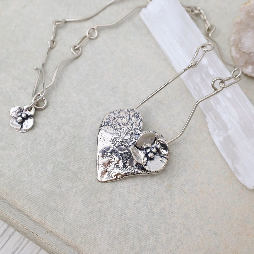 
                      
                        NKL Heart with Dogwood Flower Necklace
                      
                    