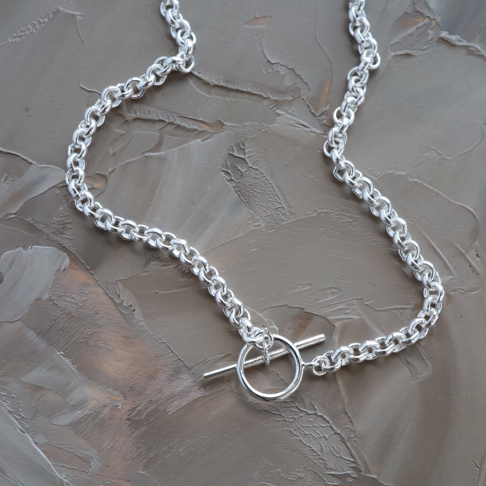 Grey hollow chain store stitching neutral necklace