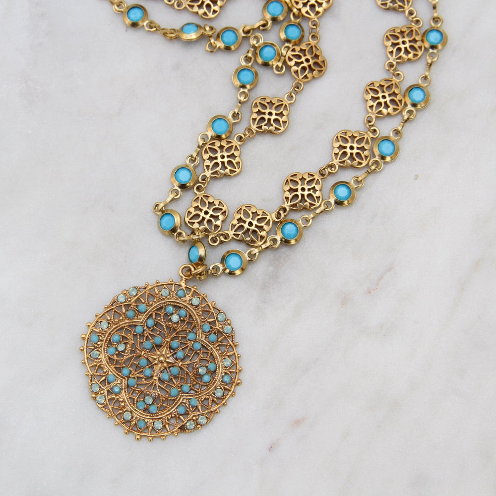 
                      
                        NKL-JM Double Strand Gold Filagree & Turquoise Crystal Bead Chain Necklace
                      
                    