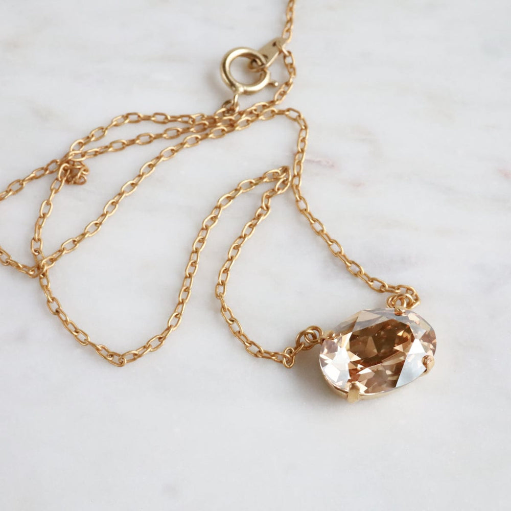 
                  
                    NKL-JM Gold Oval Crystal Pendant - Champagne
                  
                