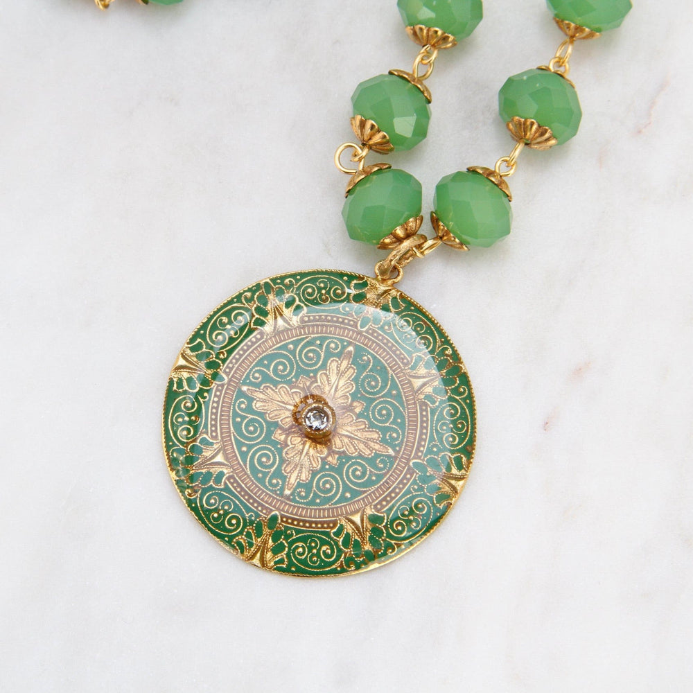 
                      
                        NKL-JM Green Enamel Madallion on Bead Chain - Gold Plate
                      
                    