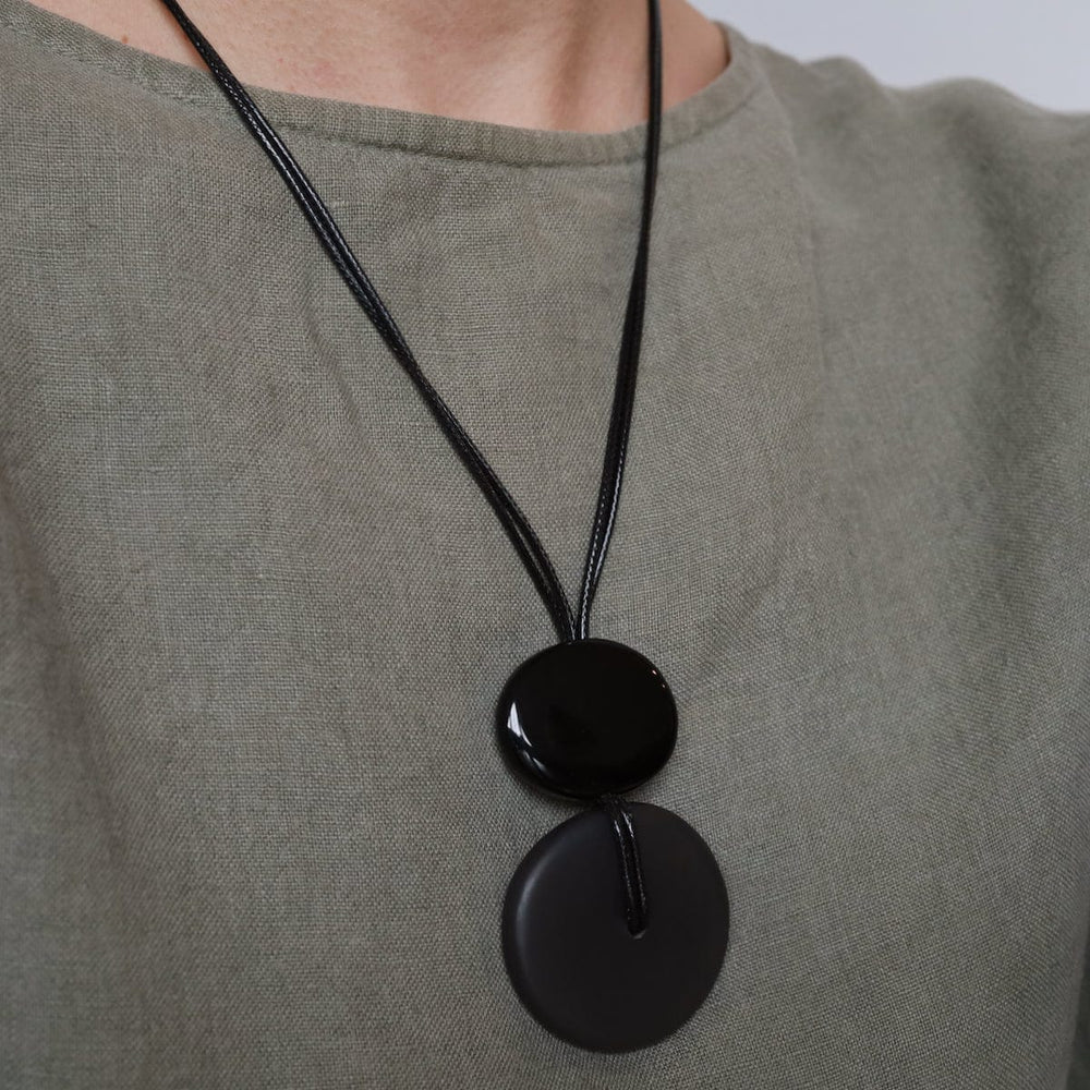 
                  
                    NKL-JM Grey Resin Sliding Pendant Necklace
                  
                