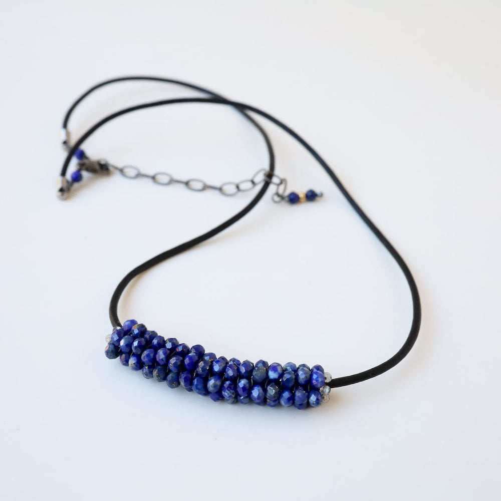 
                  
                    NKL-JM Hand Stitched Lapis with Silver Trim Necklace
                  
                