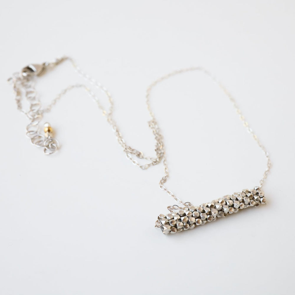 
                      
                        NKL-JM Hand Stitched Tiny Sterling Silver Cubes Necklace
                      
                    