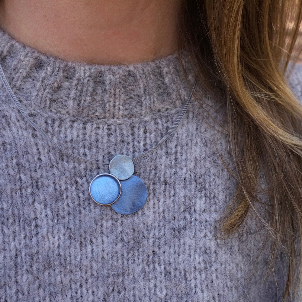 
                      
                        NKL-JM Light Blue Triple Circle Necklace
                      
                    