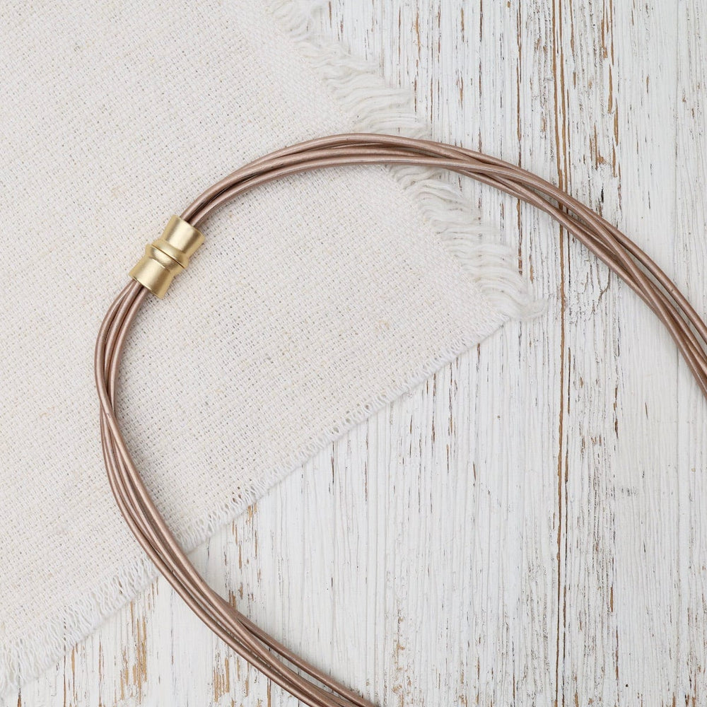 
                  
                    NKL-JM Matte Gold Champagne Leather Necklace
                  
                