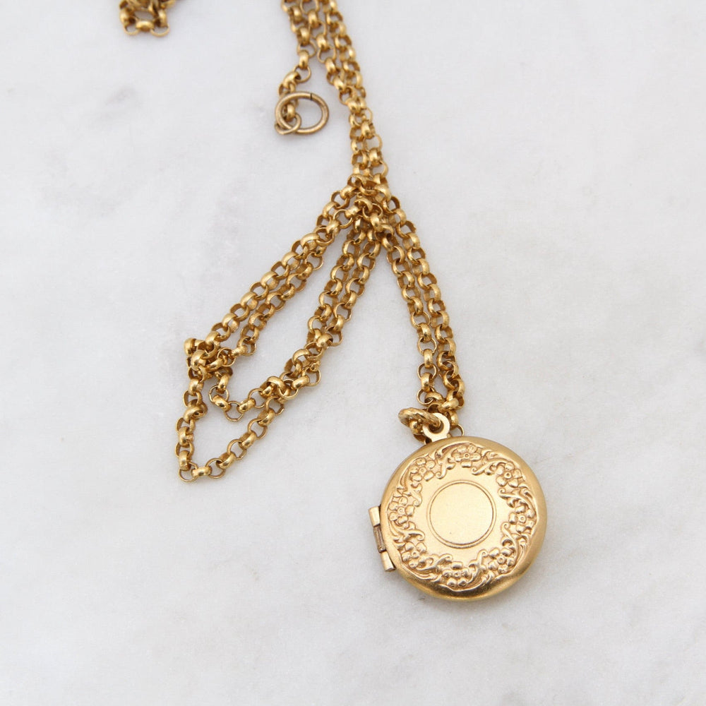 
                  
                    NKL-JM Round Flower Wreath Locket Necklace - Gold Plate
                  
                