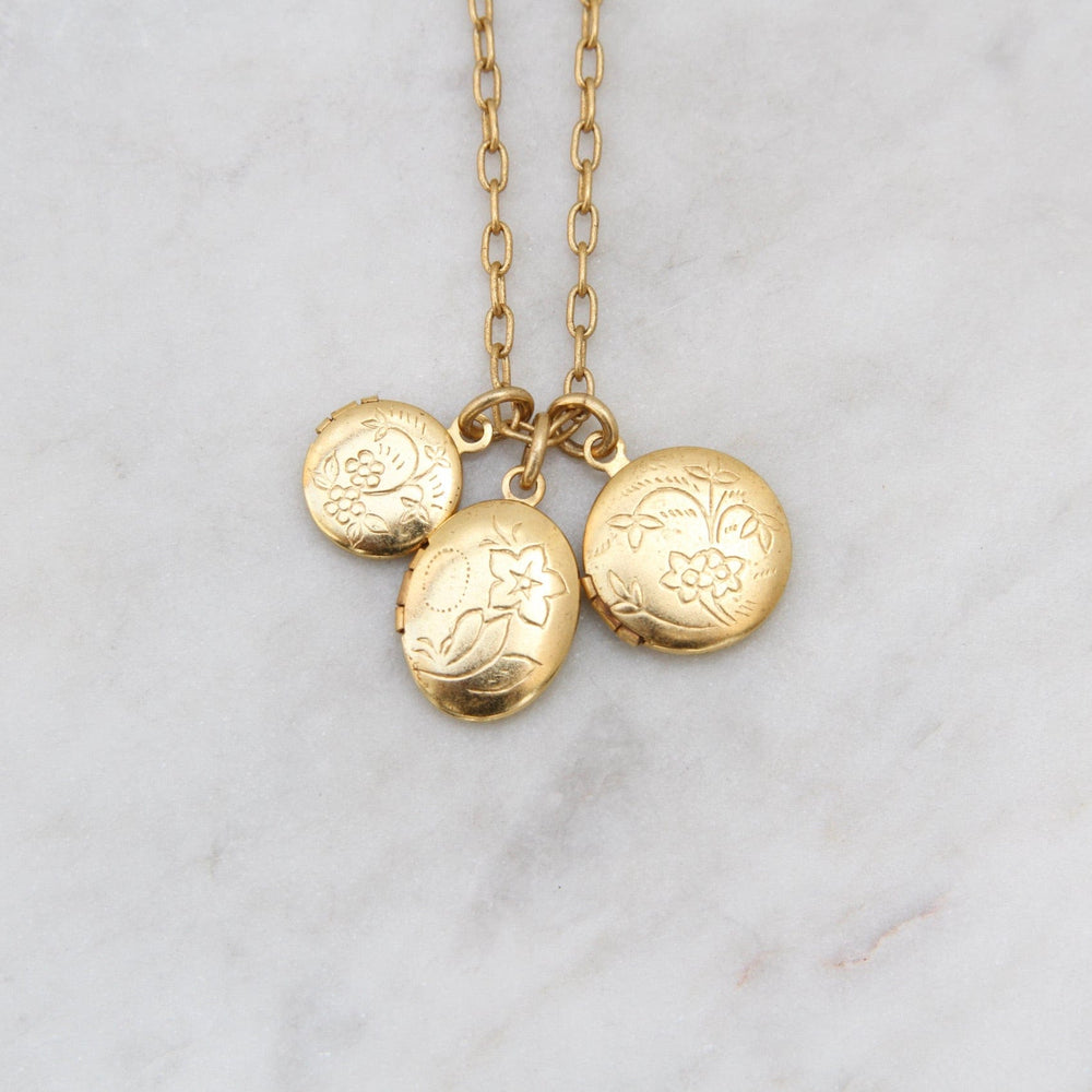 
                  
                    NKL-JM Triple Locket Necklace - Gold Plate
                  
                