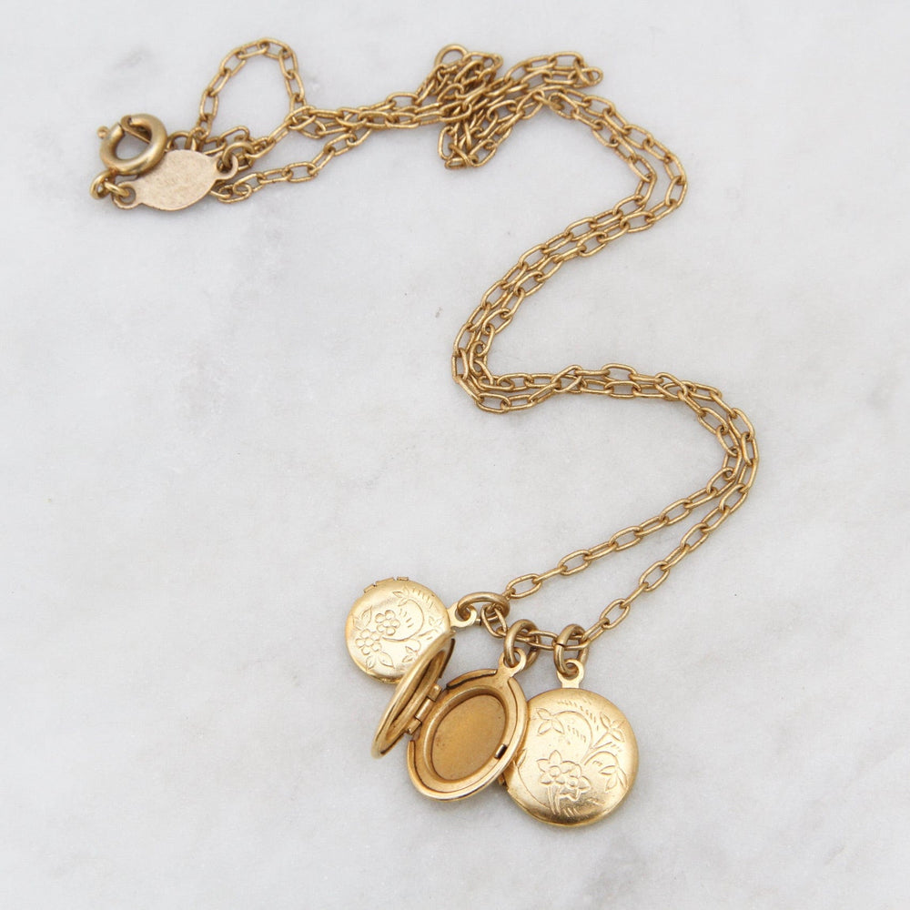 
                  
                    NKL-JM Triple Locket Necklace - Gold Plate
                  
                