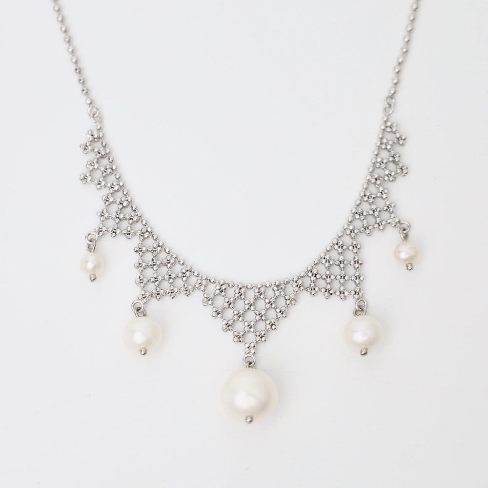 
                      
                        NKL Lace Points with White Pearls Necklace
                      
                    