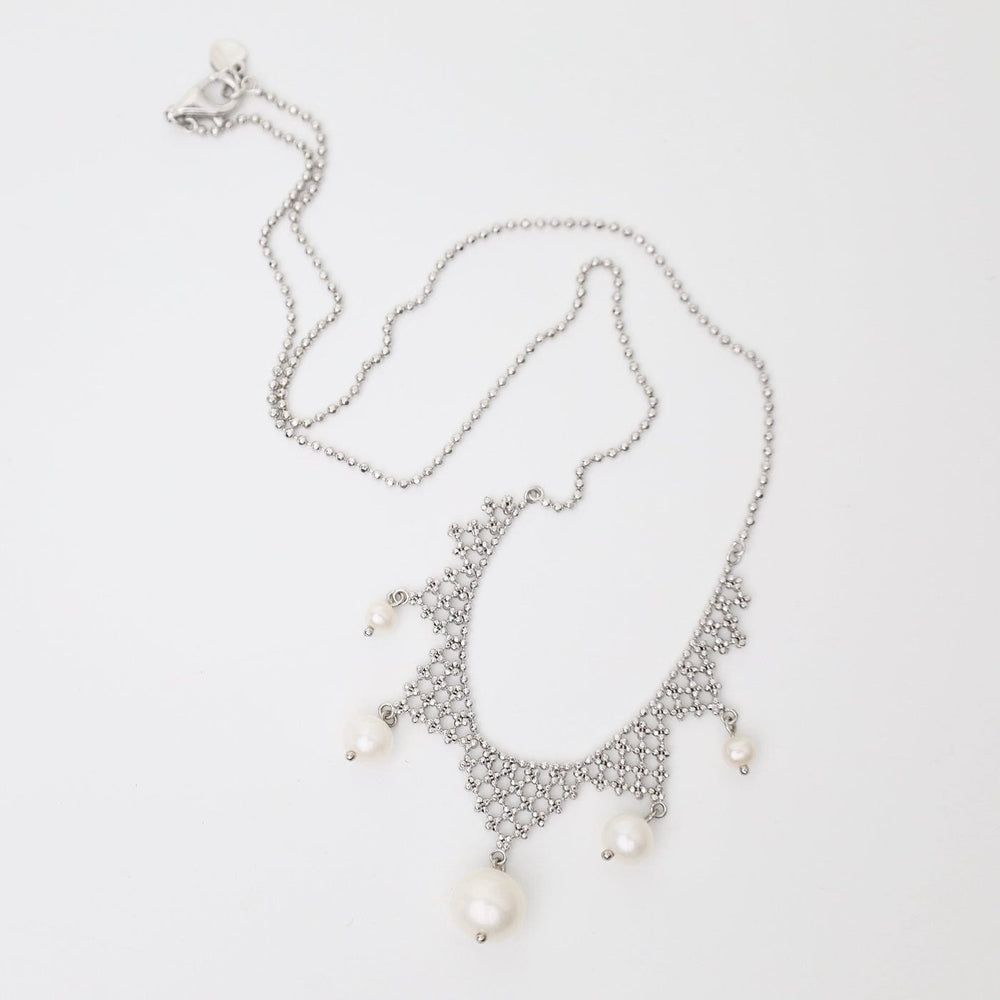 
                      
                        NKL Lace Points with White Pearls Necklace
                      
                    