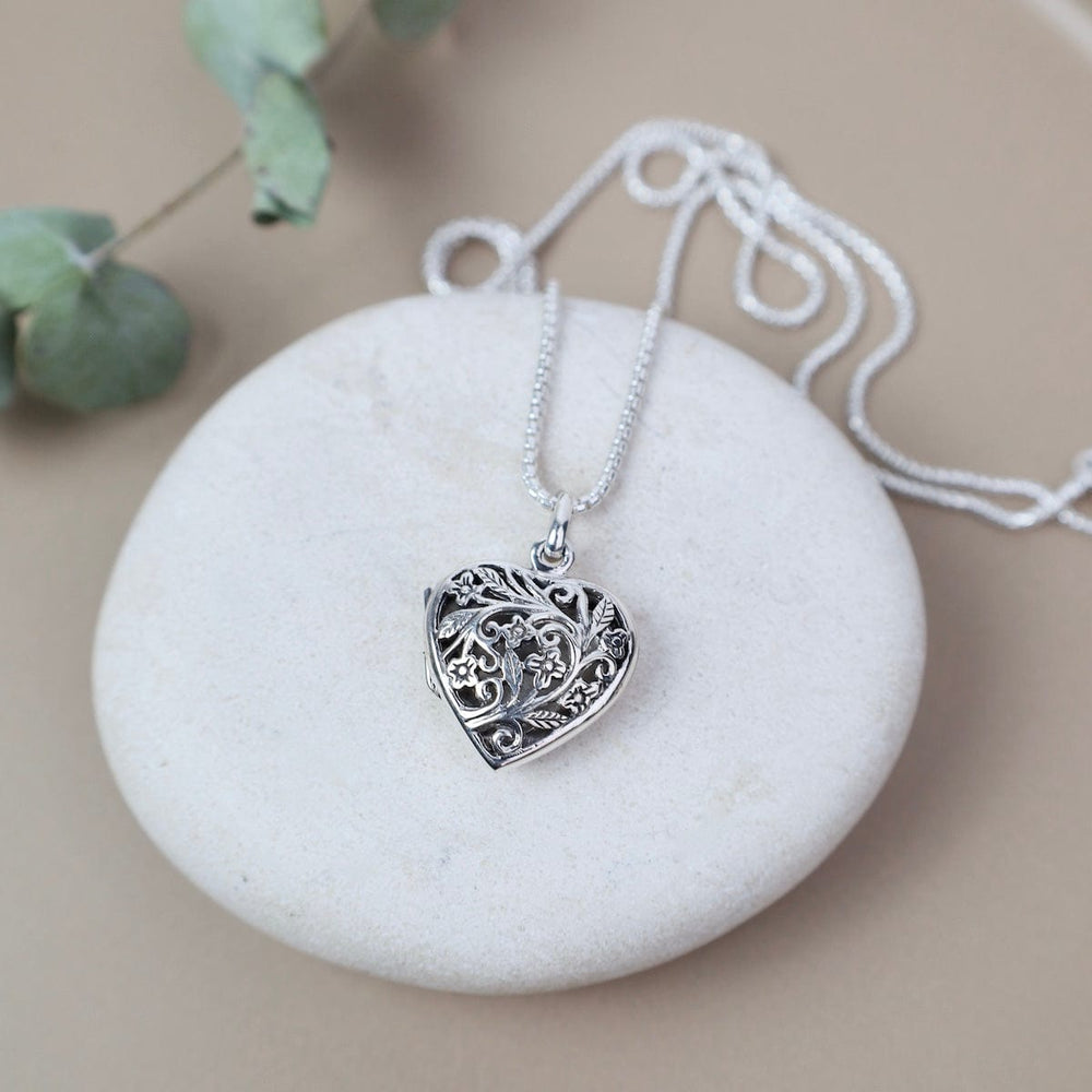 
                  
                    NKL Large Heart with Cut-out Flower Filagree Locket Necklace
                  
                