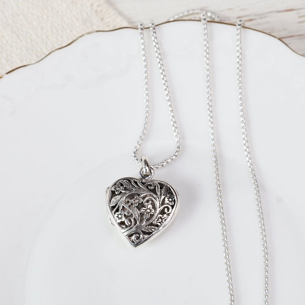 
                  
                    NKL Large Heart with Cut-out Flower Filagree Locket Necklace
                  
                