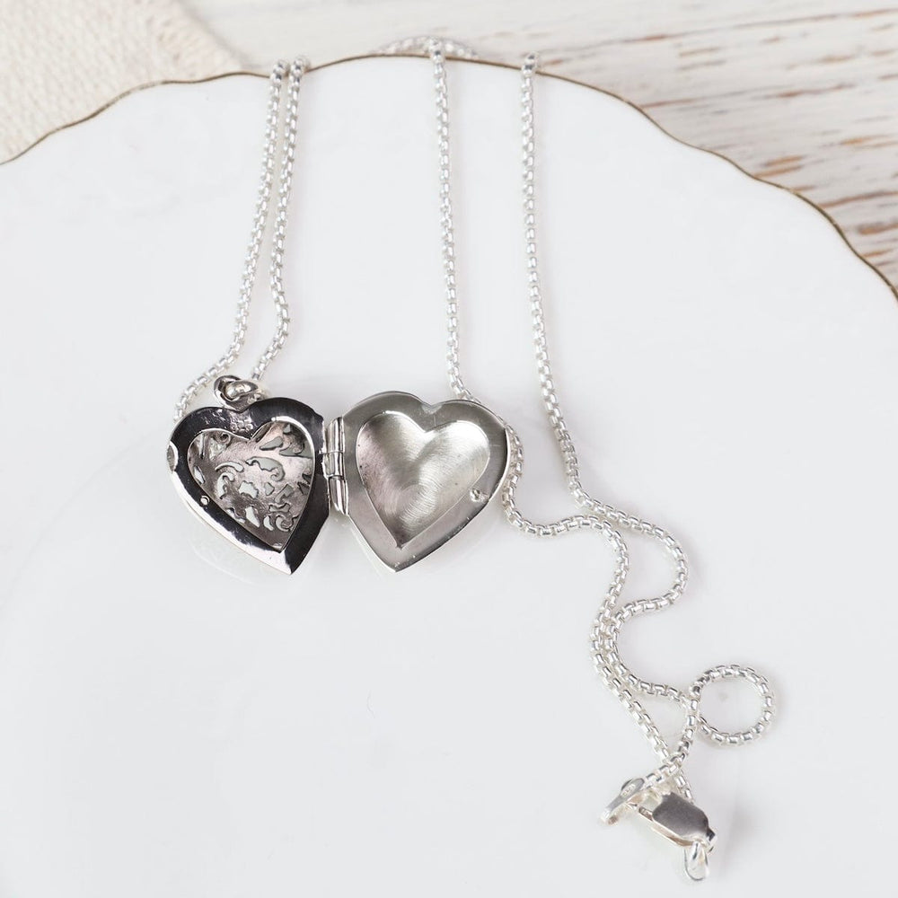 
                  
                    NKL Large Heart with Cut-out Flower Filagree Locket Necklace
                  
                