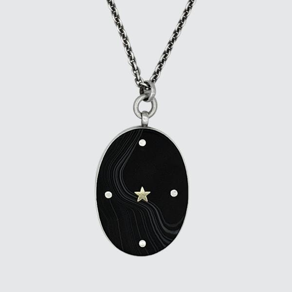 
                      
                        NKL Large Oval Black Banded Onyx Pendant Necklace with Gold star
                      
                    